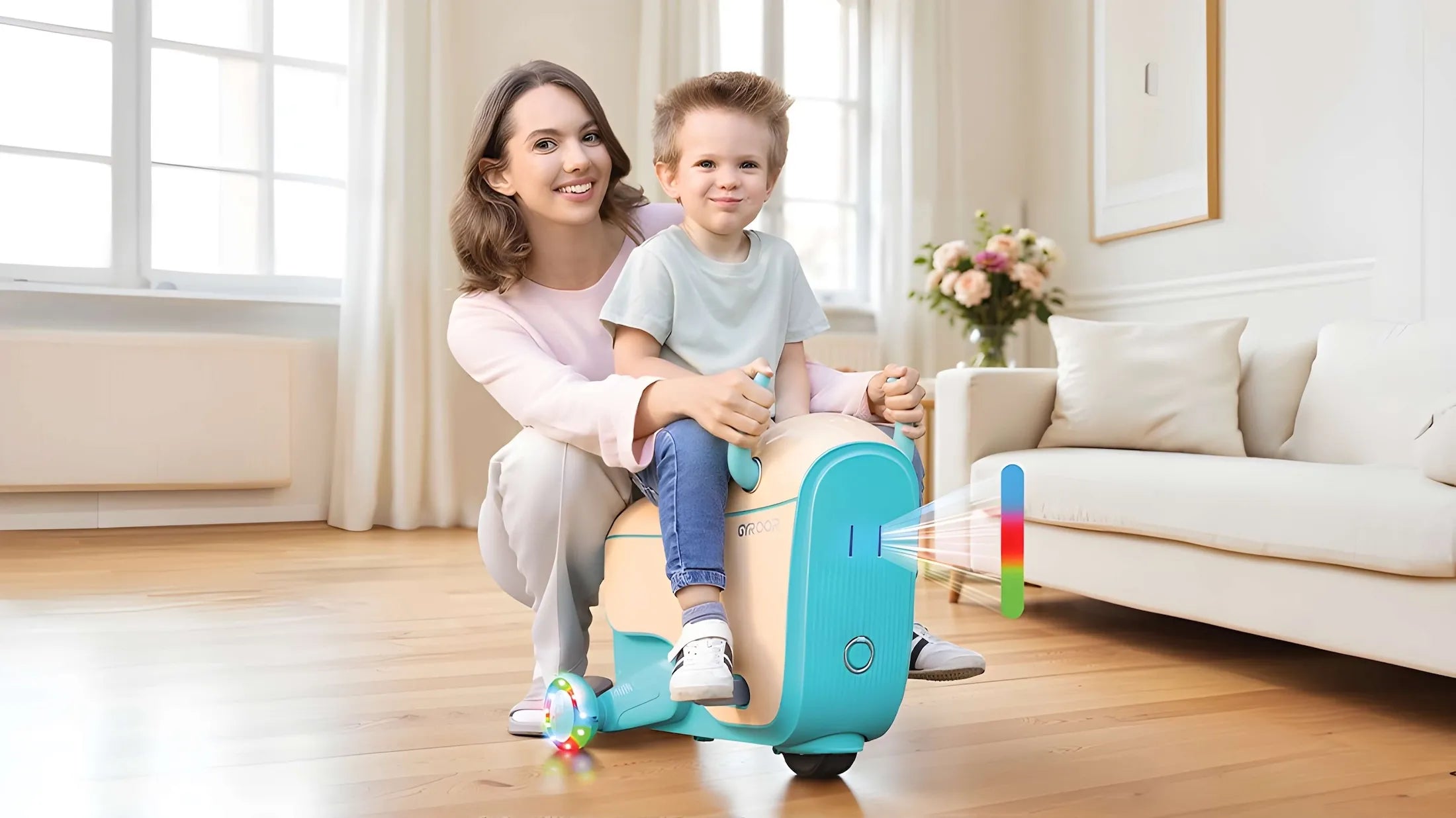 Woman and child playing with a colorful GYROOR GUN Kids Electric Suitcase in a living room.